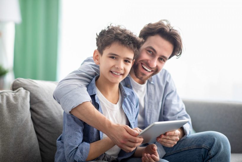 family-time-happy-dad-and-son-using-digital-tablet-browsing-internet-online-at-home-sitting-e1632233068896.jpg family-time-happy-dad-and-son-using-digital-tablet-browsing-internet-online-at-home-sitting-e1632233068896.jpg